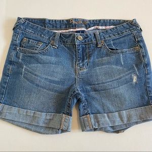 Medium wash jean shorts.